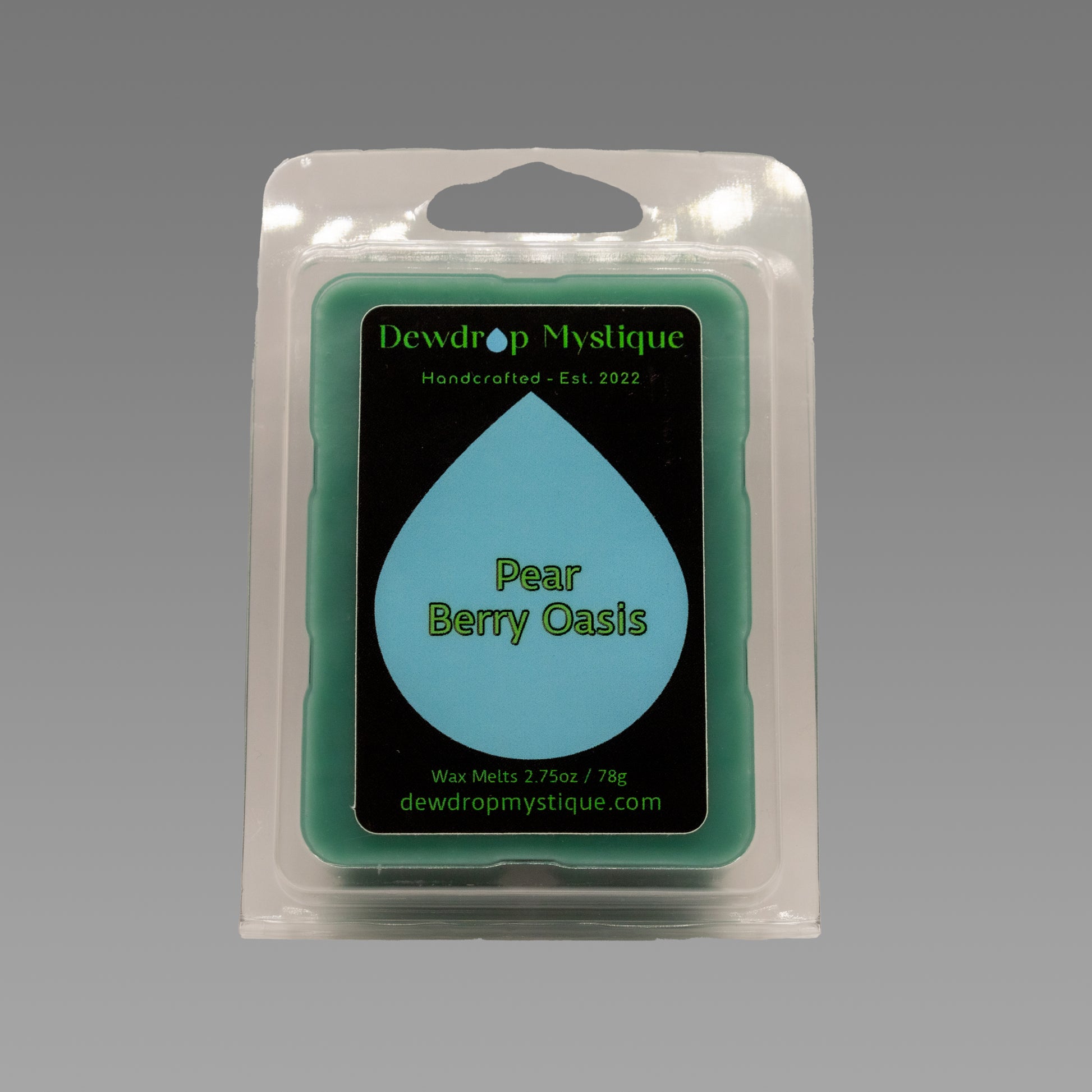 A packaged wax melt that reads 'Pear Berry Oasis'.
